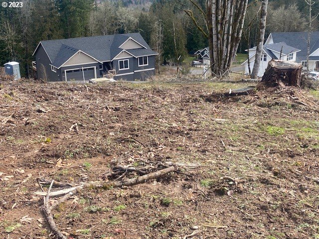 Hawthorne, Unit 8 Scappoose, OR 97056 - Photo 3 of 5 a front view of a house with a yard