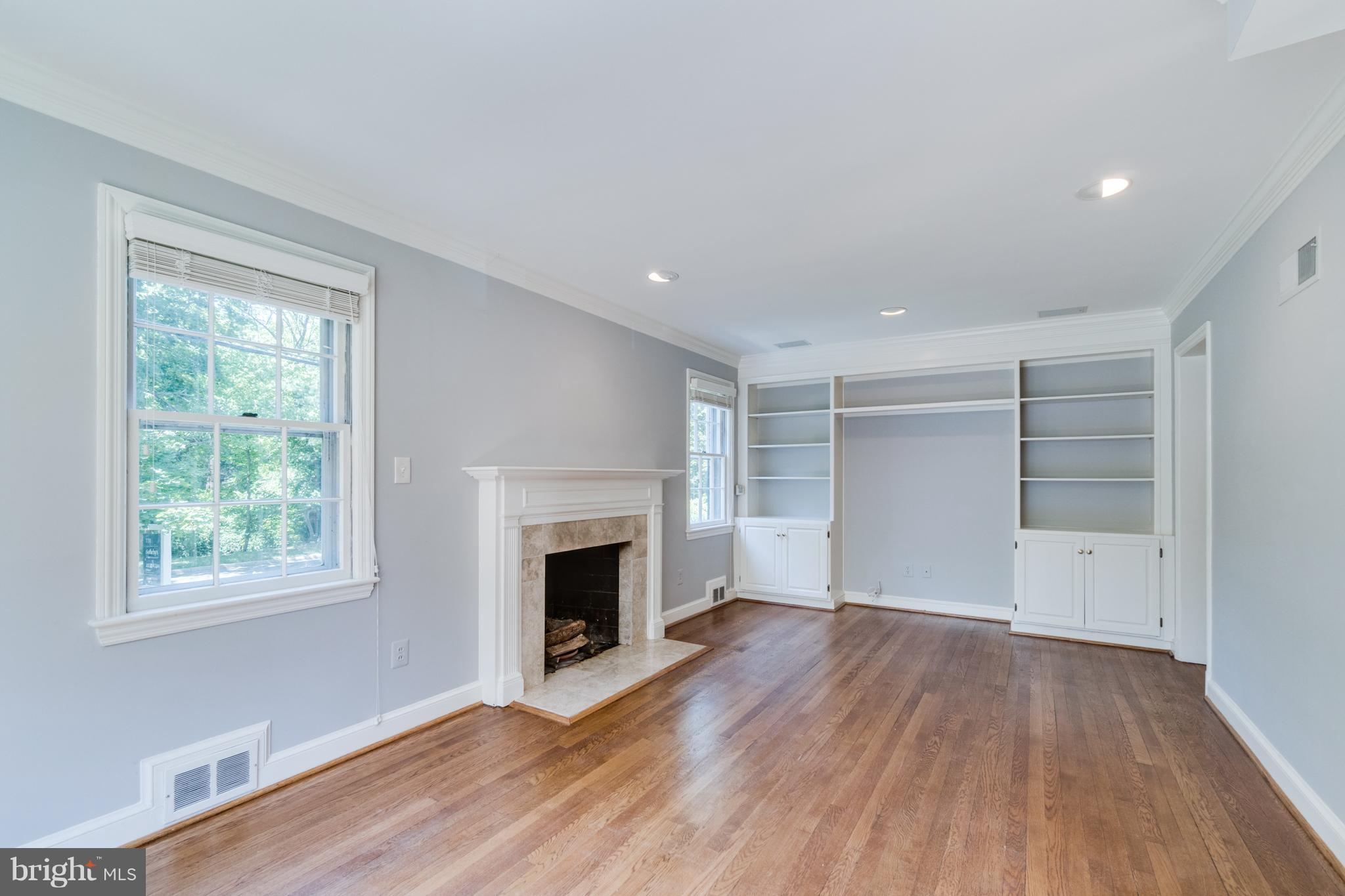 6105 Gloster Road Bethesda, MD 20816 - Photo 11 of 26 Living Room with Built-Ins, Wood-Burning Fireplace