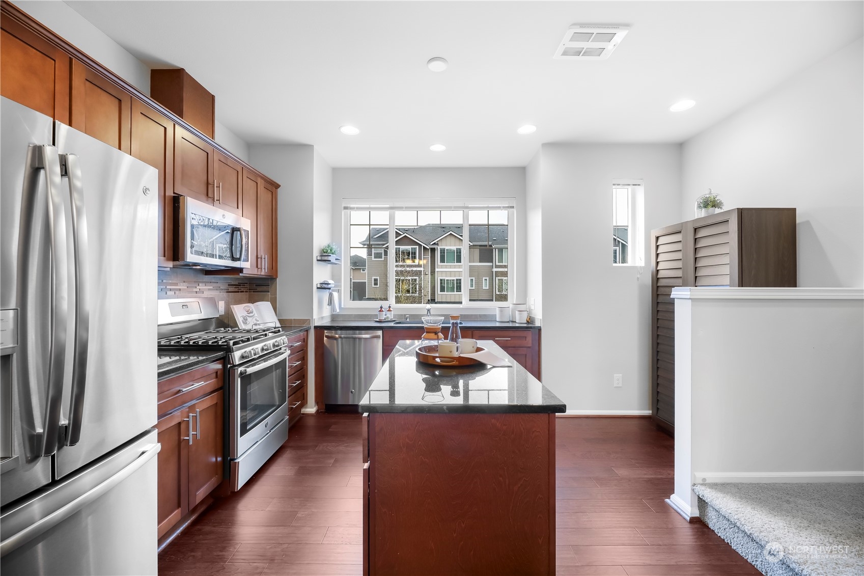 3345 30th Drive Everett, WA 98201 - Photo 12 of 37 a kitchen with stainless steel appliances granite countertop a refrigerator a stove a sink and a microwave