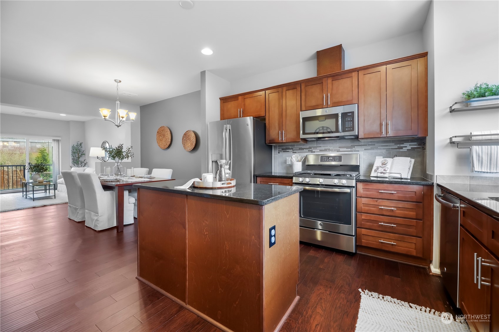 3345 30th Drive Everett, WA 98201 - Photo 13 of 37 a kitchen with stainless steel appliances kitchen island granite countertop a stove a sink and a refrigerator