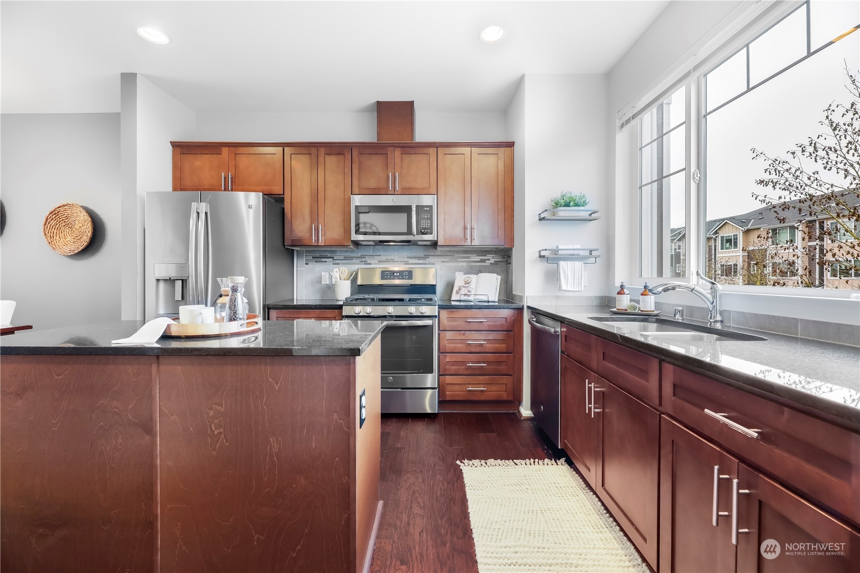 3345 30th Drive Everett, WA 98201 - Photo 14 of 37 a kitchen with stainless steel appliances granite countertop a sink stove and refrigerator