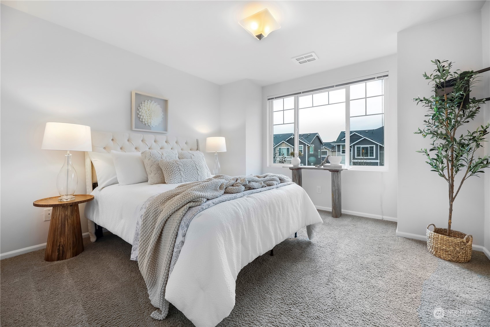 3345 30th Drive Everett, WA 98201 - Photo 17 of 37 a bedroom with bed and a potted plant