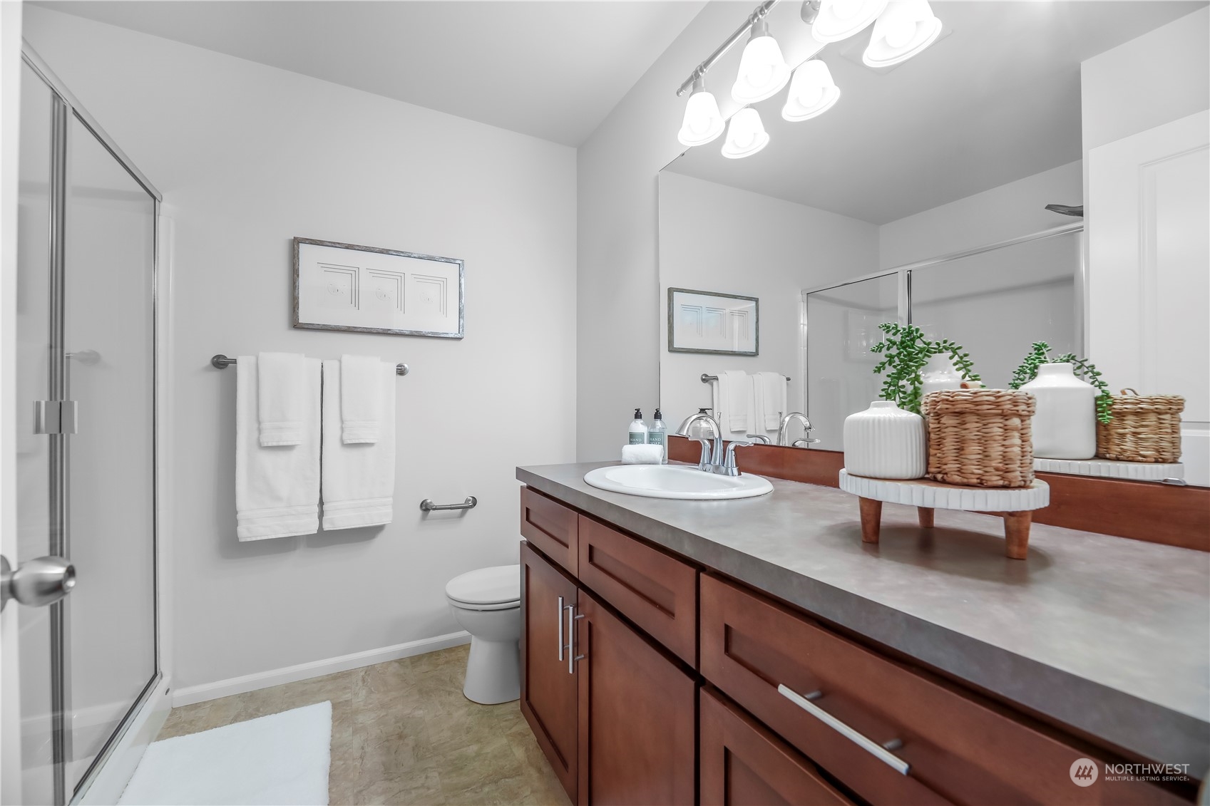 3345 30th Drive Everett, WA 98201 - Photo 19 of 37 a spacious bathroom with a granite countertop sink a toilet and mirror