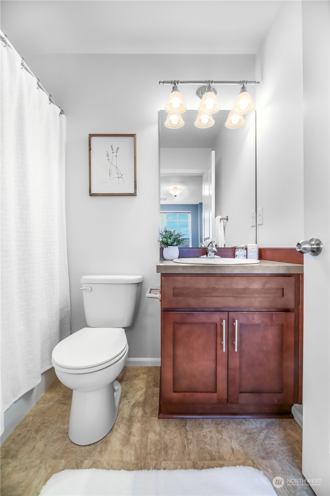 3345 30th Drive Everett, WA 98201 - Photo 23 of 37 a bathroom with a toilet a sink and mirror