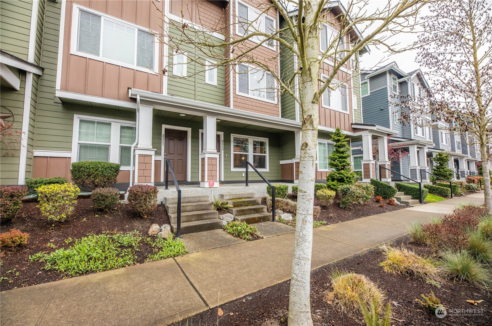 3345 30th Drive Everett, WA 98201 - Photo 28 of 37 front view of a brick house with a small yard