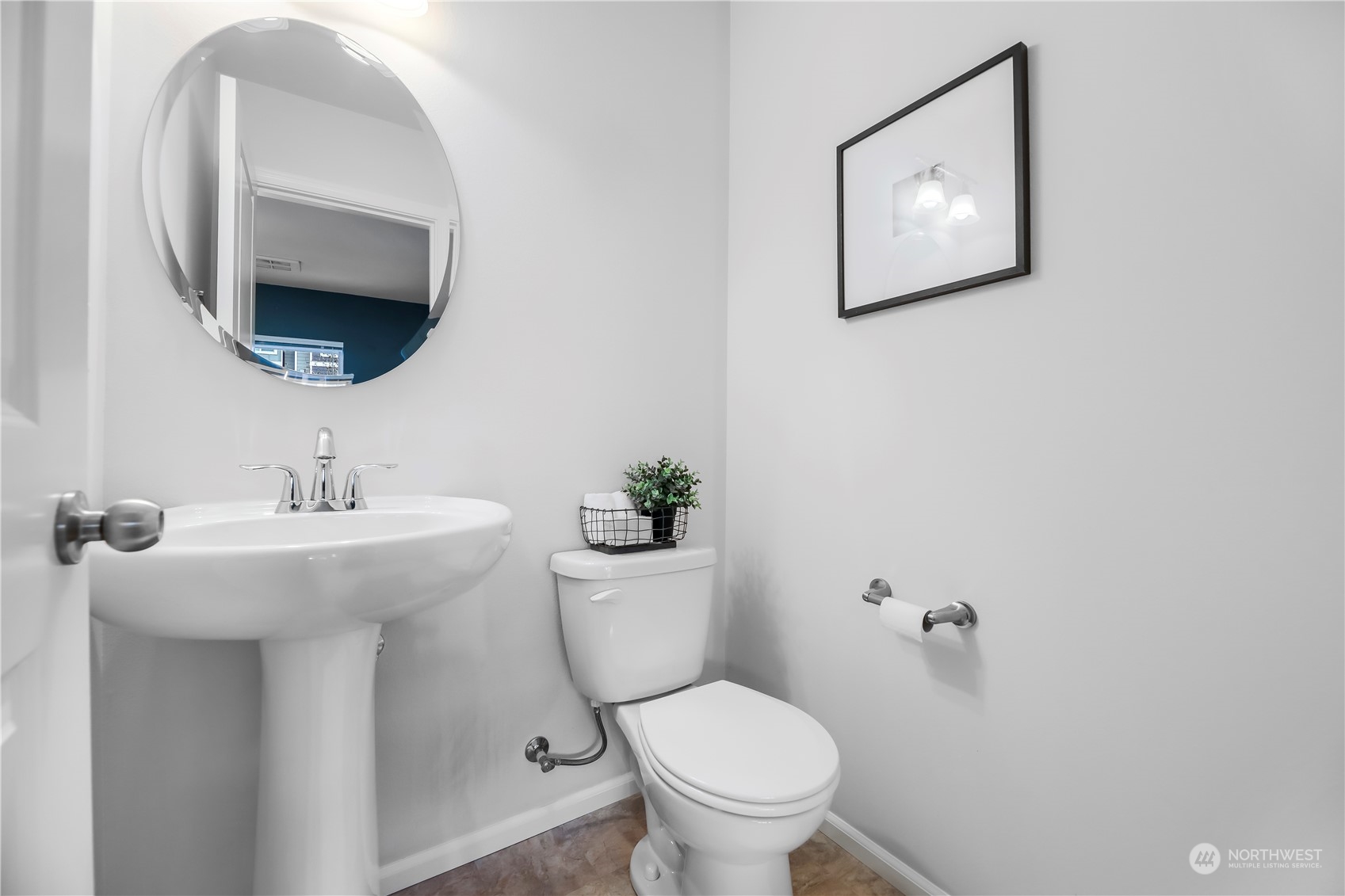 3345 30th Drive Everett, WA 98201 - Photo 6 of 37 a bathroom with a toilet a sink and mirror