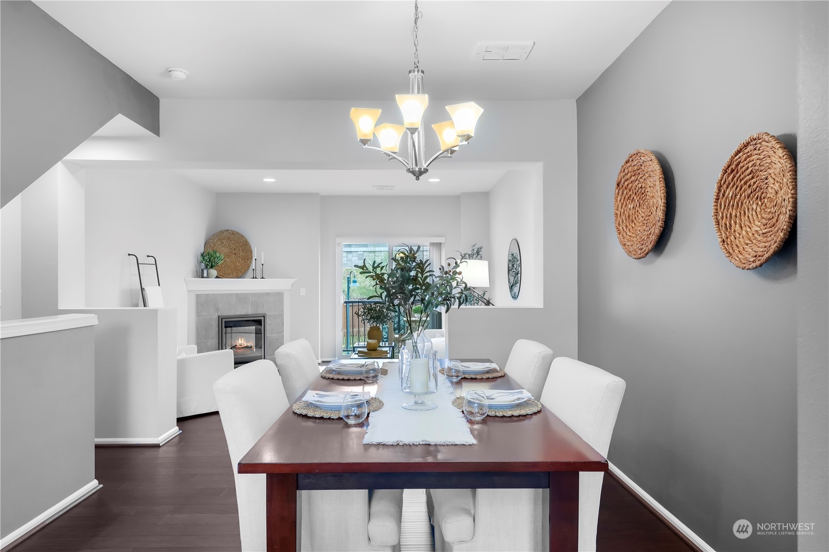 3345 30th Drive Everett, WA 98201 - Photo 10 of 37 a view of a dining room with furniture a potted plant and wooden floor