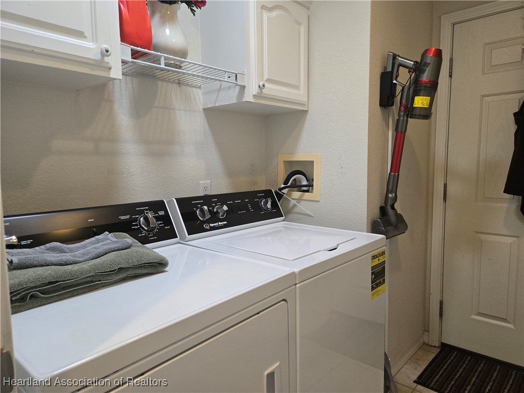3312 Beartooth Pass Sebring, FL 33872 - Photo 29 of 39 a utility room with dryer and washer