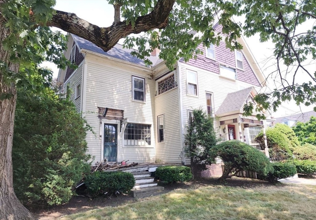 399 South Main Street Haverhill, MA 01835 - Photo 3 of 17 a view of a house with a yard and potted plants