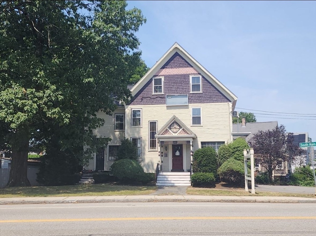 399 South Main Street Haverhill, MA 01835 - Photo 5 of 17 a front view of a house with a yard