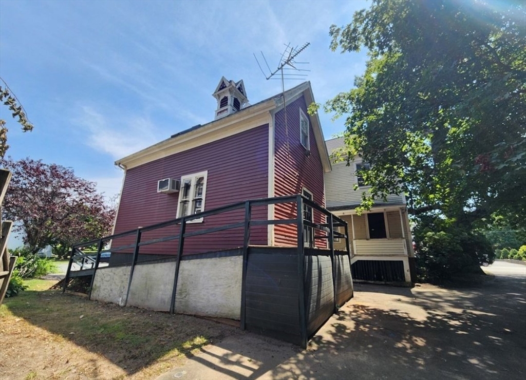 399 South Main Street Haverhill, MA 01835 - Photo 6 of 17 a view of a house with a yard