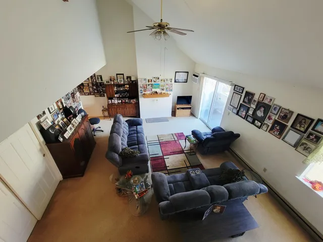 a view of a backyard with furniture and a fire pit
