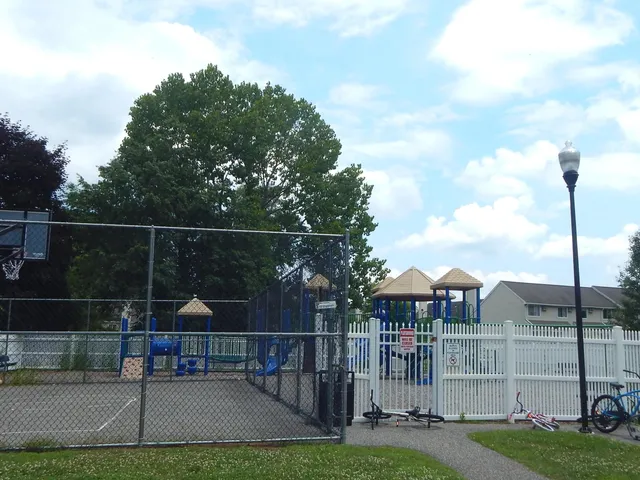 a front view of a house with a yard table and chairs