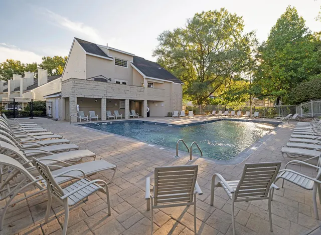 a view of a park with large trees
