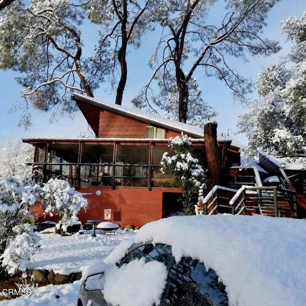 253 Evans Road Wofford Heights, CA 93285 - Photo 5 of 13 a view of a patio with table and chairs under an umbrella