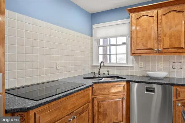a dining room with furniture a window and wooden floor