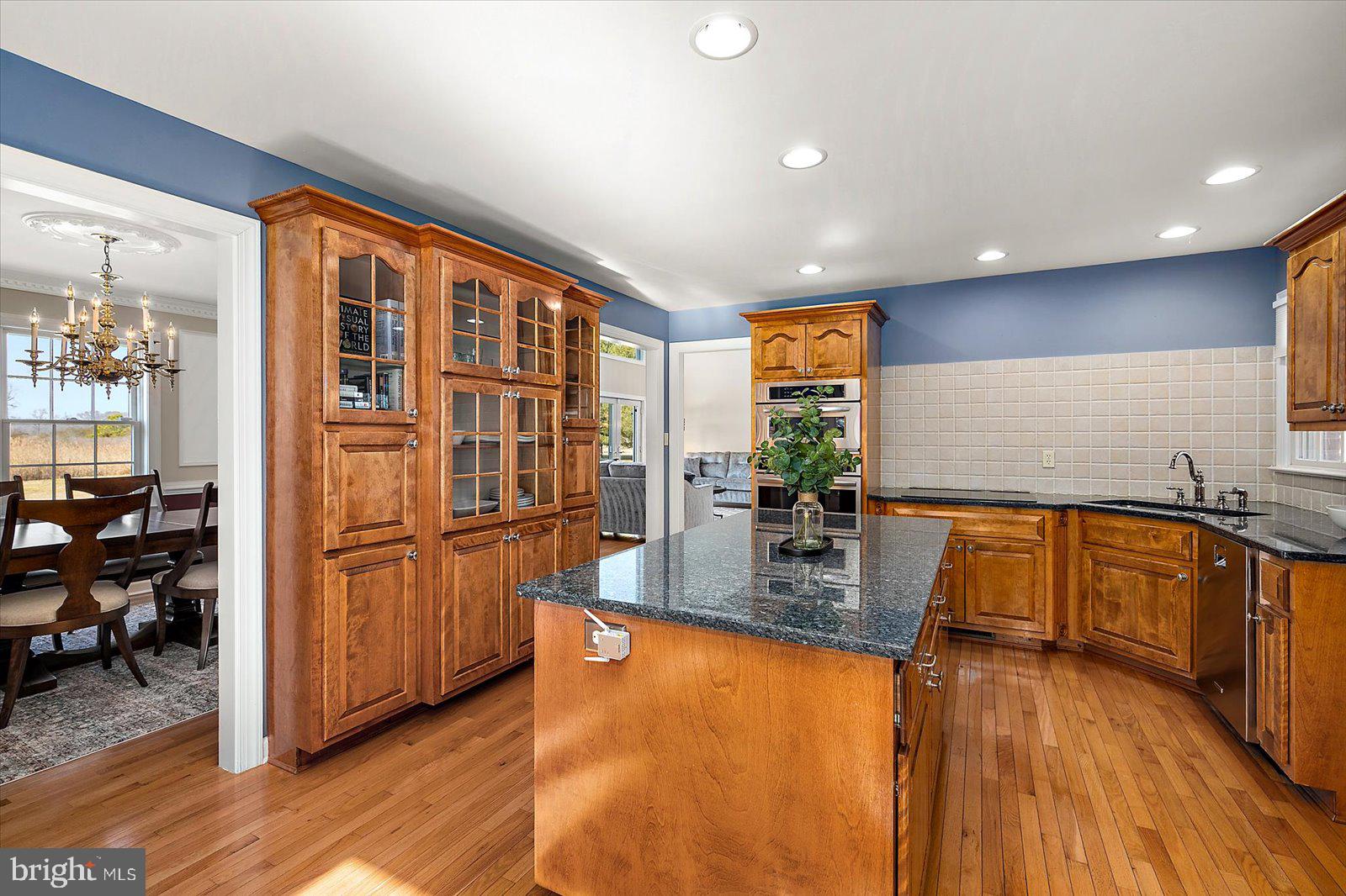 12661 Mallard Landing Road Princess Anne, MD 21853 - Photo 20 of 123 a kitchen with stainless steel appliances granite countertop a refrigerator a stove and a wooden floors