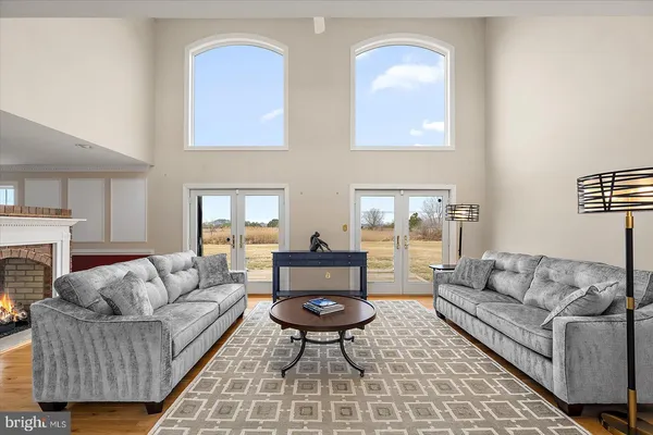a view of staircase with wooden floor and a floor to ceiling window