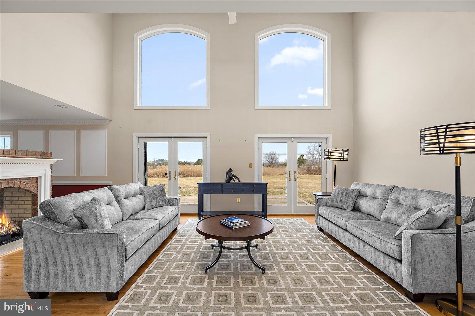 12661 Mallard Landing Road Princess Anne, MD 21853 - Photo 28 of 123 a living room with furniture and a fireplace