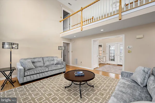 a bathroom with a bathtub sink and mirror