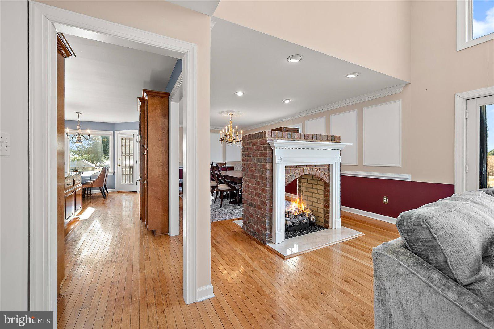 12661 Mallard Landing Road Princess Anne, MD 21853 - Photo 34 of 123 a living room with furniture and a fireplace
