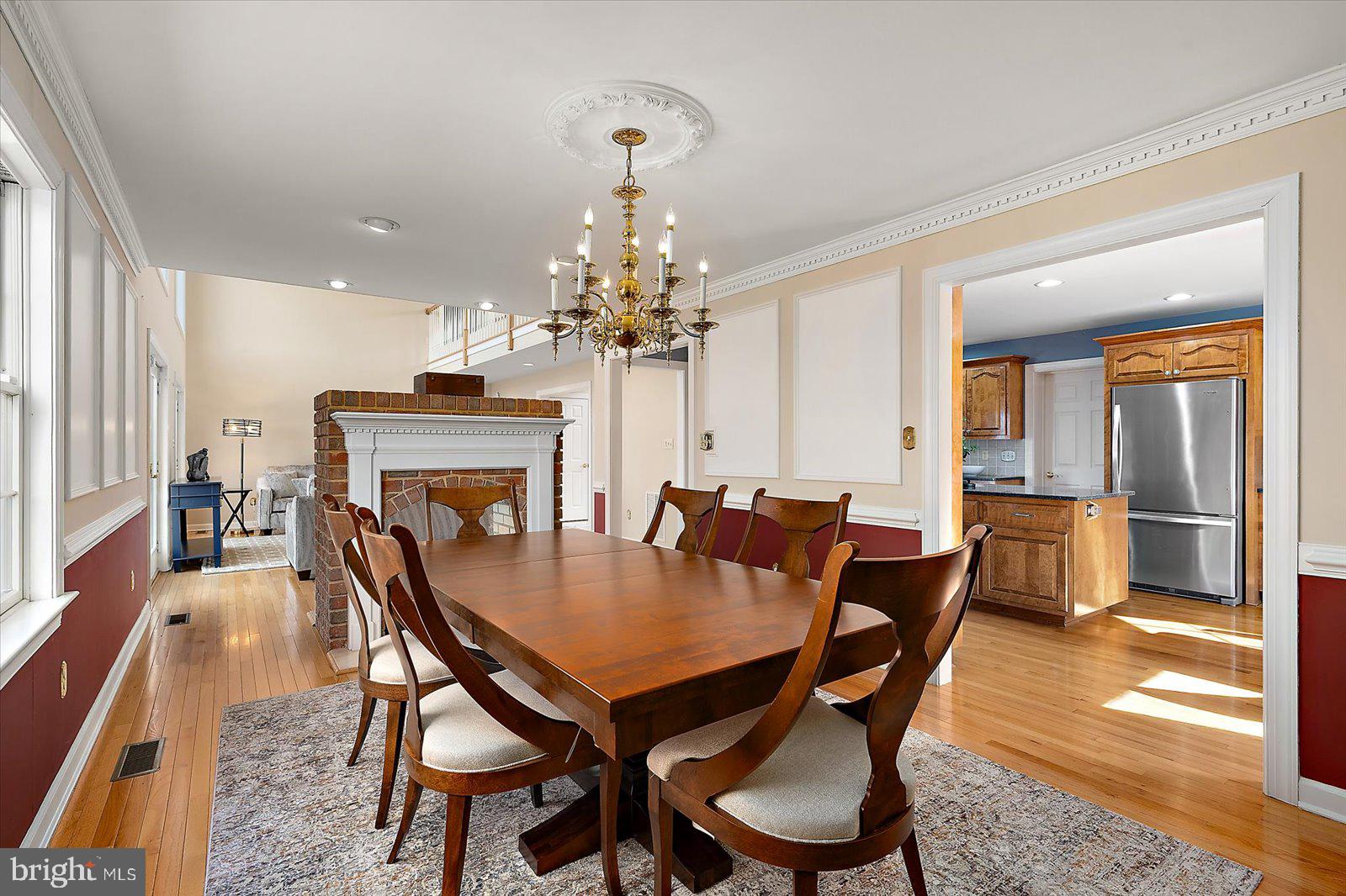 12661 Mallard Landing Road Princess Anne, MD 21853 - Photo 42 of 123 a view of a dining room with furniture and a chandelier