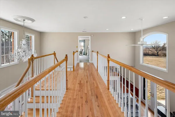 an aerial view of a house with swimming pool outdoor space and seating
