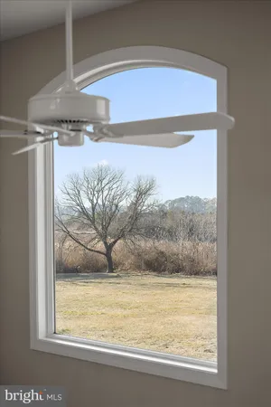 an aerial view of a house with a lake view