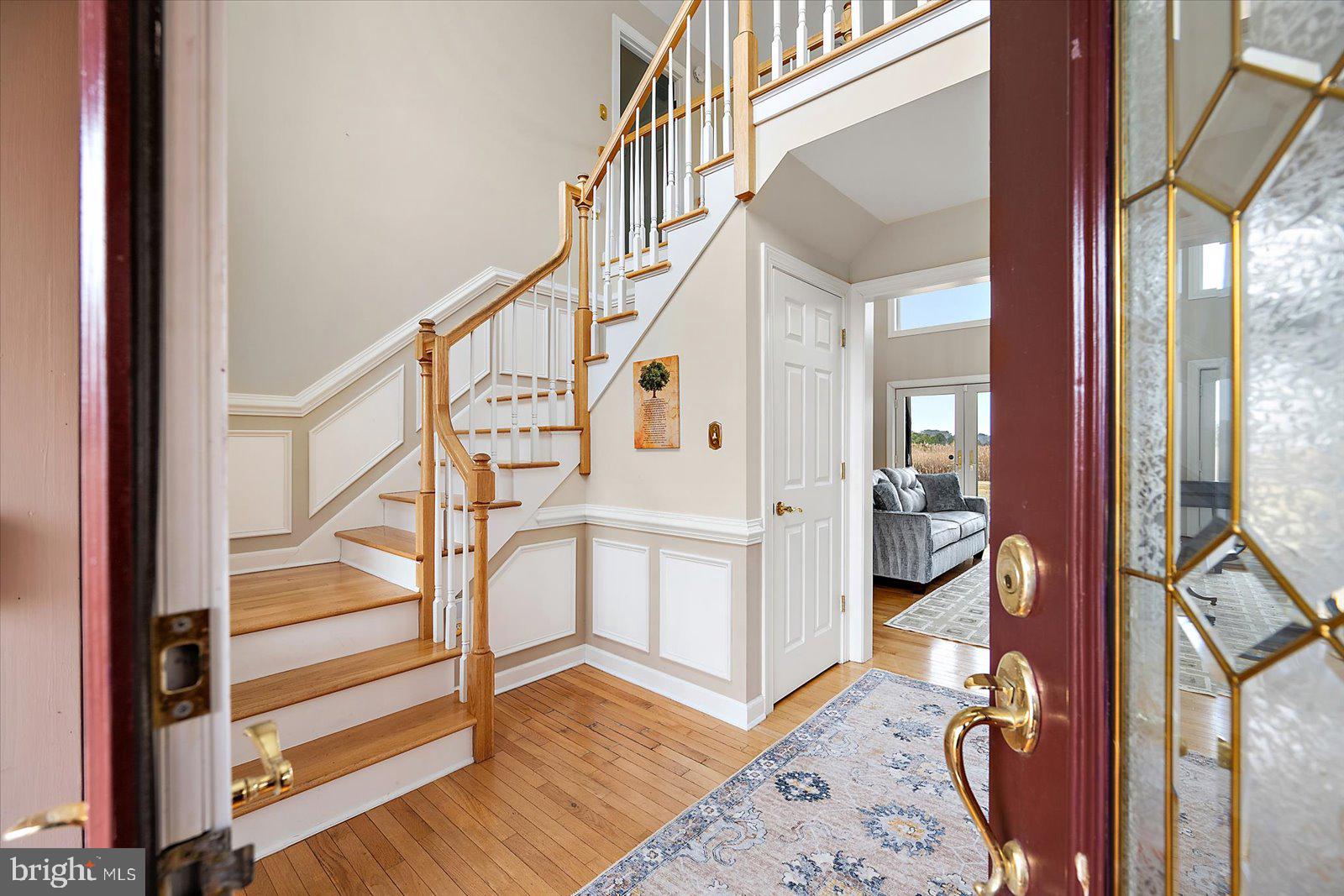 12661 Mallard Landing Road Princess Anne, MD 21853 - Photo 5 of 123 a view of an entryway with wooden floor and a livingroom view