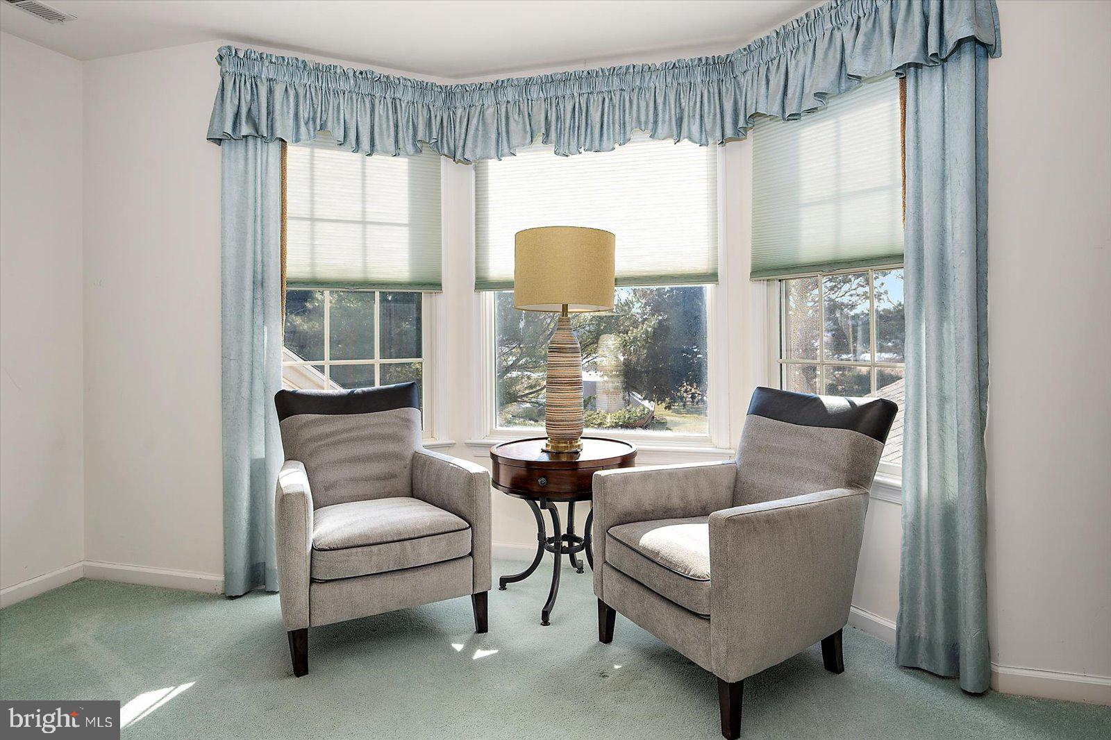 12661 Mallard Landing Road Princess Anne, MD 21853 - Photo 52 of 123 a living room with furniture and a large window