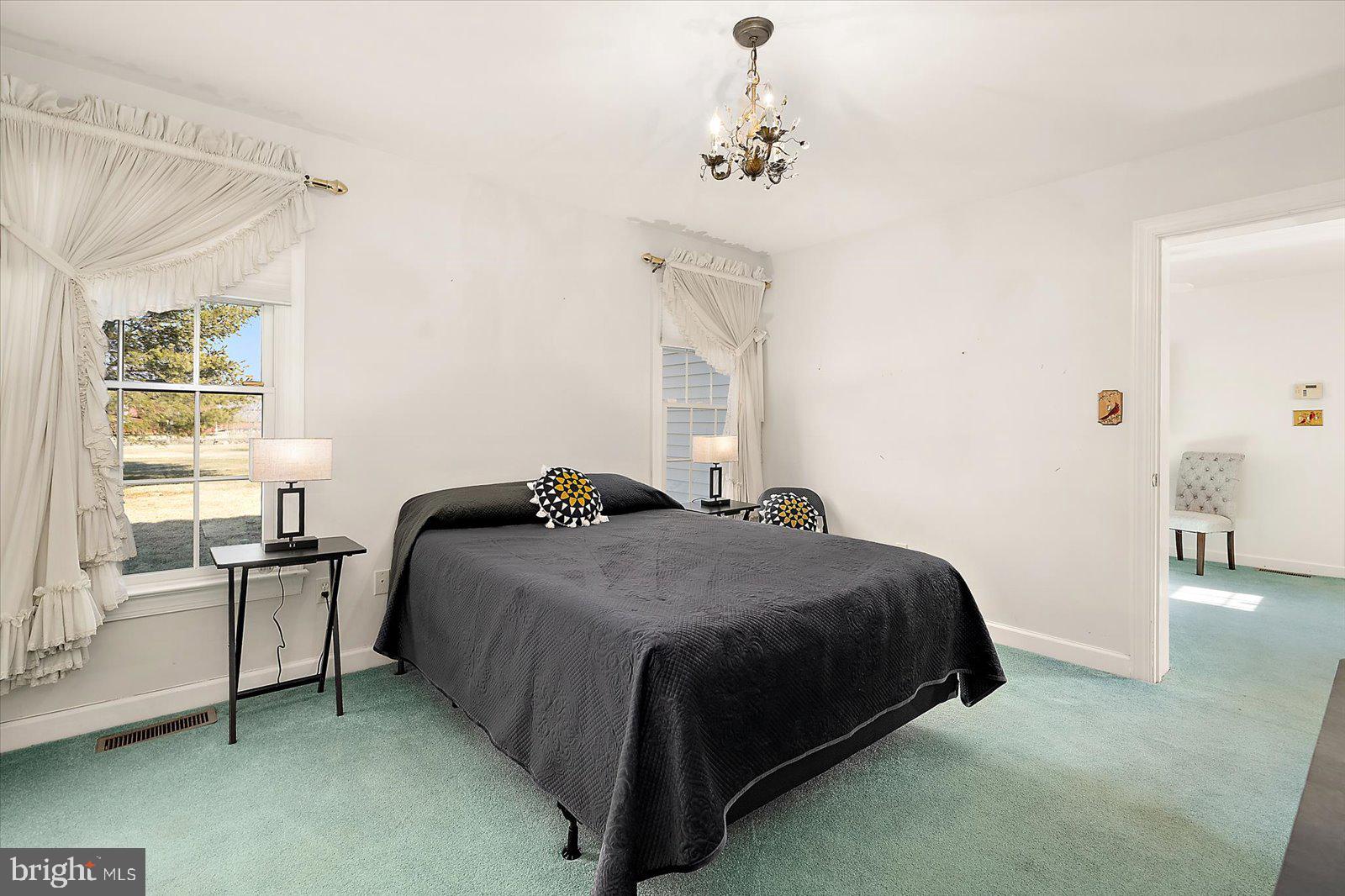 12661 Mallard Landing Road Princess Anne, MD 21853 - Photo 64 of 123 a bedroom with a bed and wooden floor