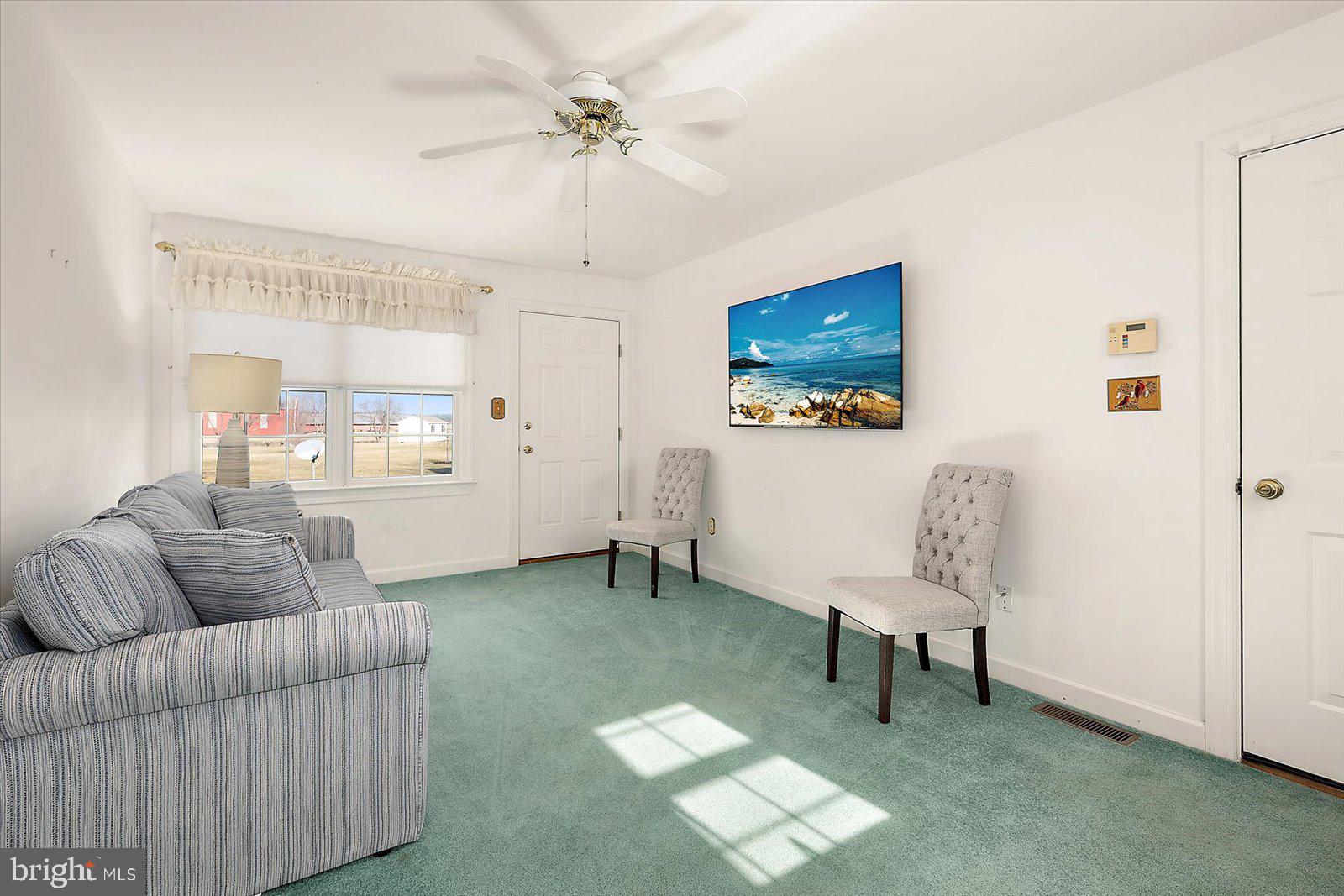 12661 Mallard Landing Road Princess Anne, MD 21853 - Photo 68 of 123 a living room with furniture and a window