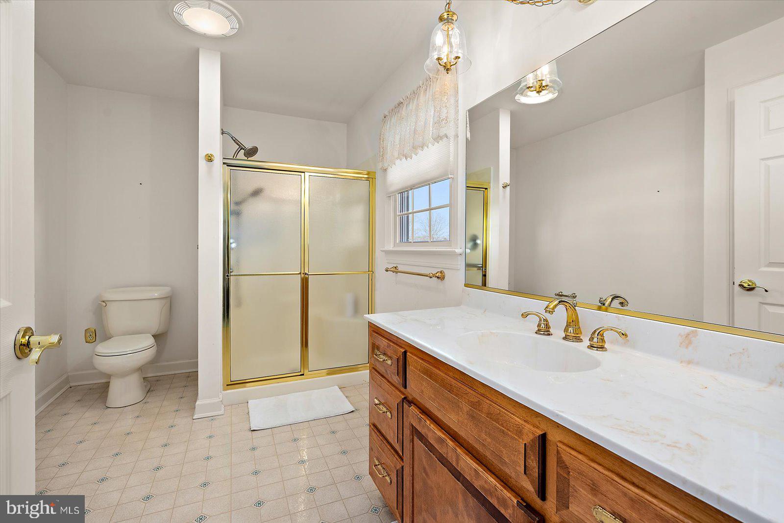 12661 Mallard Landing Road Princess Anne, MD 21853 - Photo 71 of 123 a bathroom with a sink toilet and shower