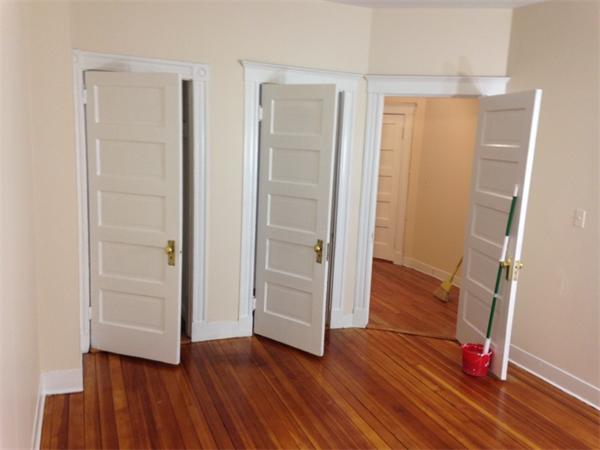 46 Orkney Road, Unit 1 Boston, MA 02135 - Photo 6 of 12 an empty room with wooden floor and closet