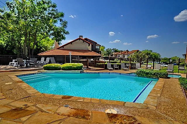 a view of a house with swimming pool yard and patio