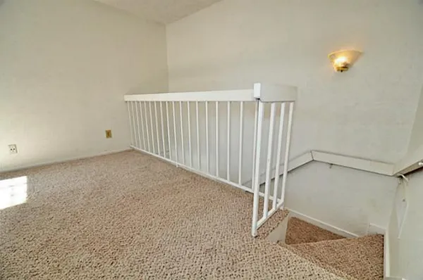 a view of a room with white walls