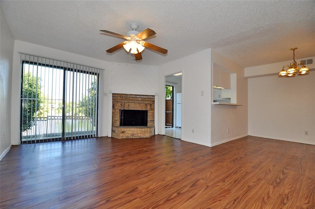 2610 Lakehill Lane, Unit 6B Carrollton, TX 75006 - Photo 15 of 18 a view of an empty room with wooden floor and a window