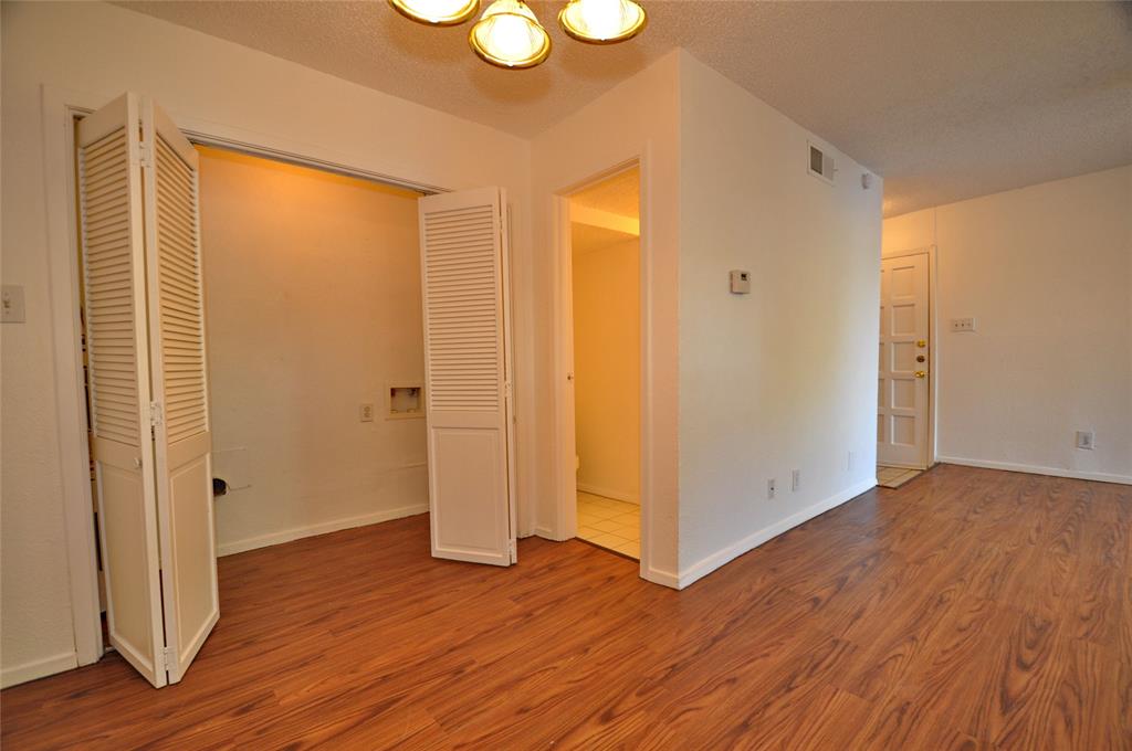2610 Lakehill Lane, Unit 6B Carrollton, TX 75006 - Photo 18 of 18 a view of an empty room with wooden floor and a window