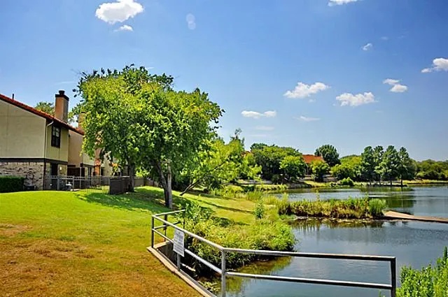 a view of a lake with a house in the background