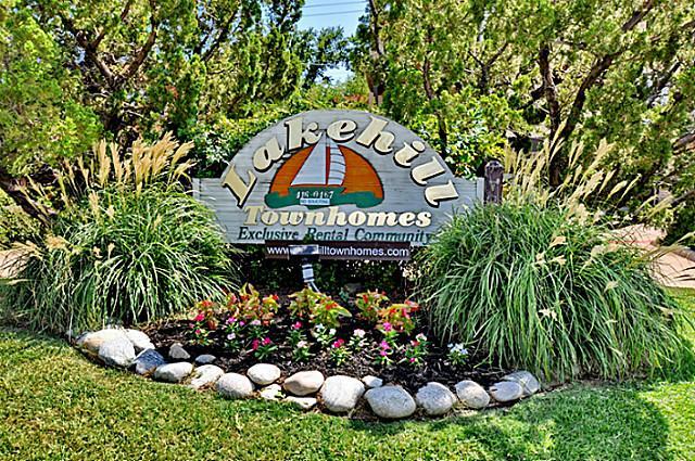 2610 Lakehill Lane, Unit 6B Carrollton, TX 75006 - Photo 5 of 18 a sign that is sitting in front of flowers