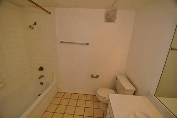 a bathroom with a sink and toilet