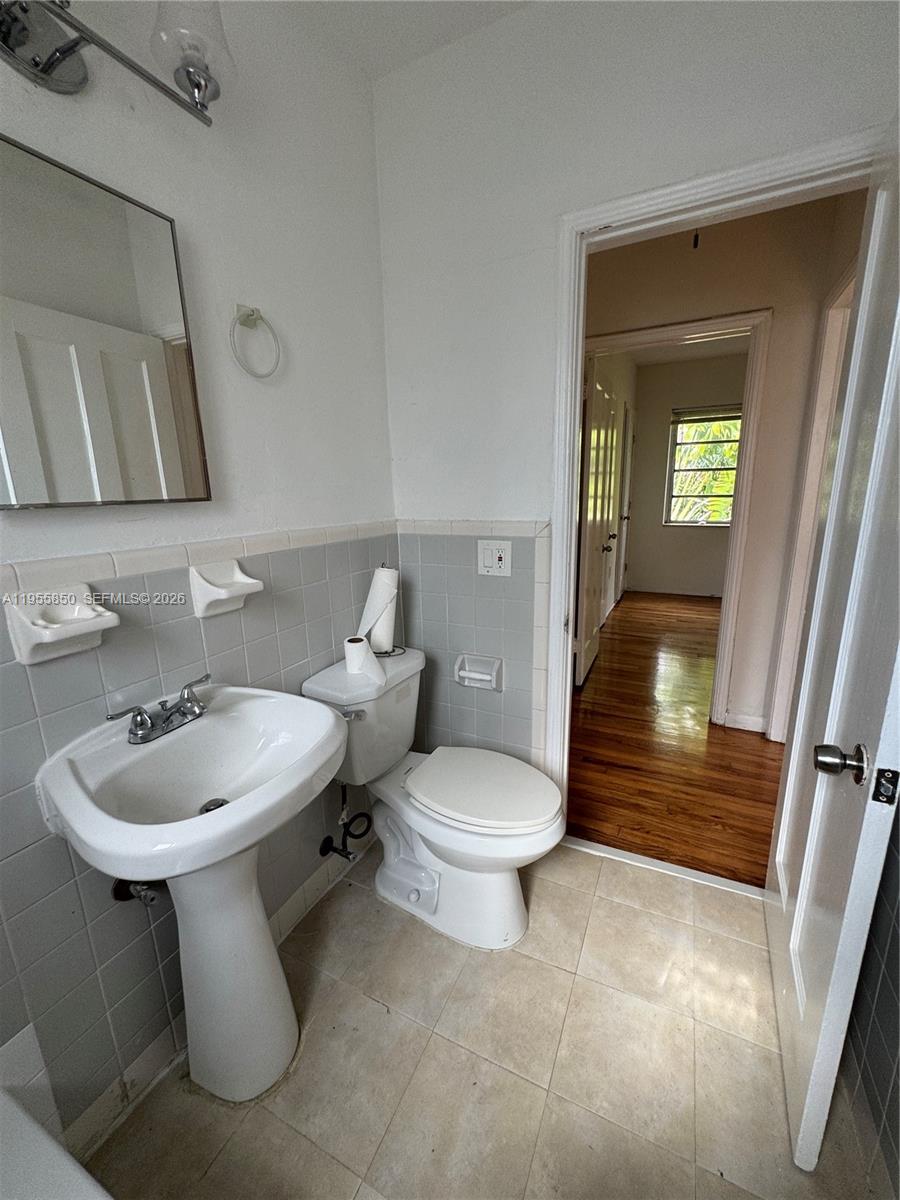 1431 Southwest 37th Avenue, Unit 4 Miami, FL 33145 - Photo 12 of 19 a bathroom with a sink toilet and shower