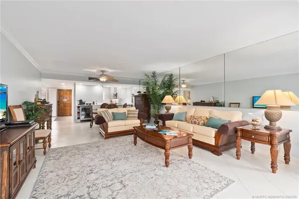 a living room with furniture and a lamp