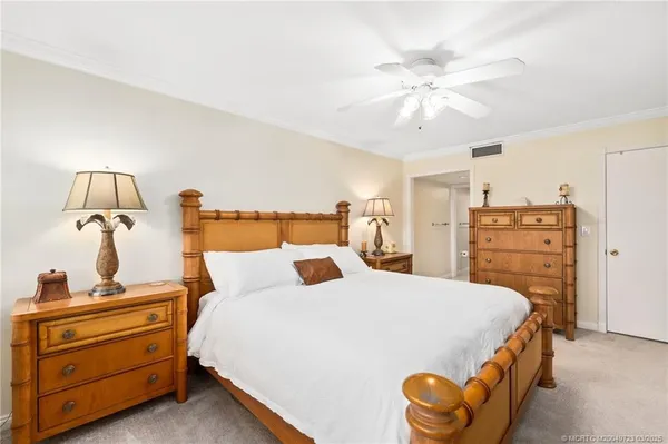 a bedroom with a bed and dresser