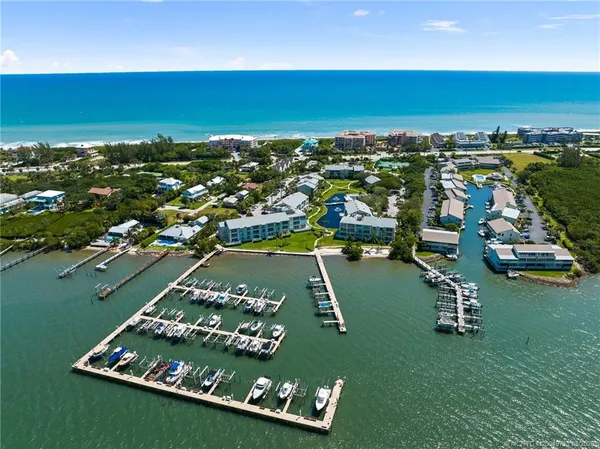 an aerial view of a residential houses with outdoor space