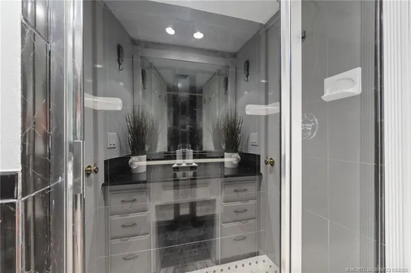 a bathroom with a double vanity sink and a mirror