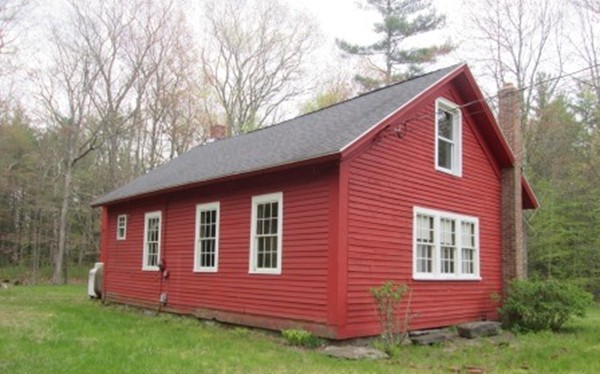 63 Spring Hill Road Barre, MA 01005 - Photo 2 of 14 a front view of a house with a garden