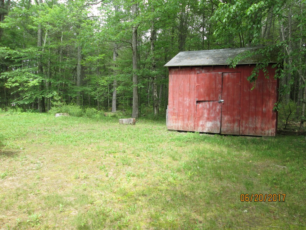 63 Spring Hill Road Barre, MA 01005 - Photo 3 of 14 a backyard of a house with lots of green space