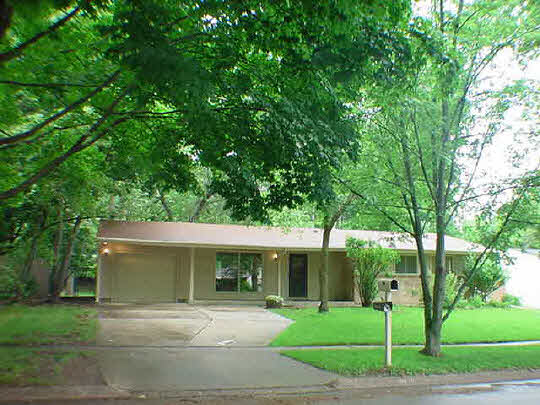 5016 Highcrest Road Rockford, IL 61107 - Photo 1 of 6 a front view of a house with a yard