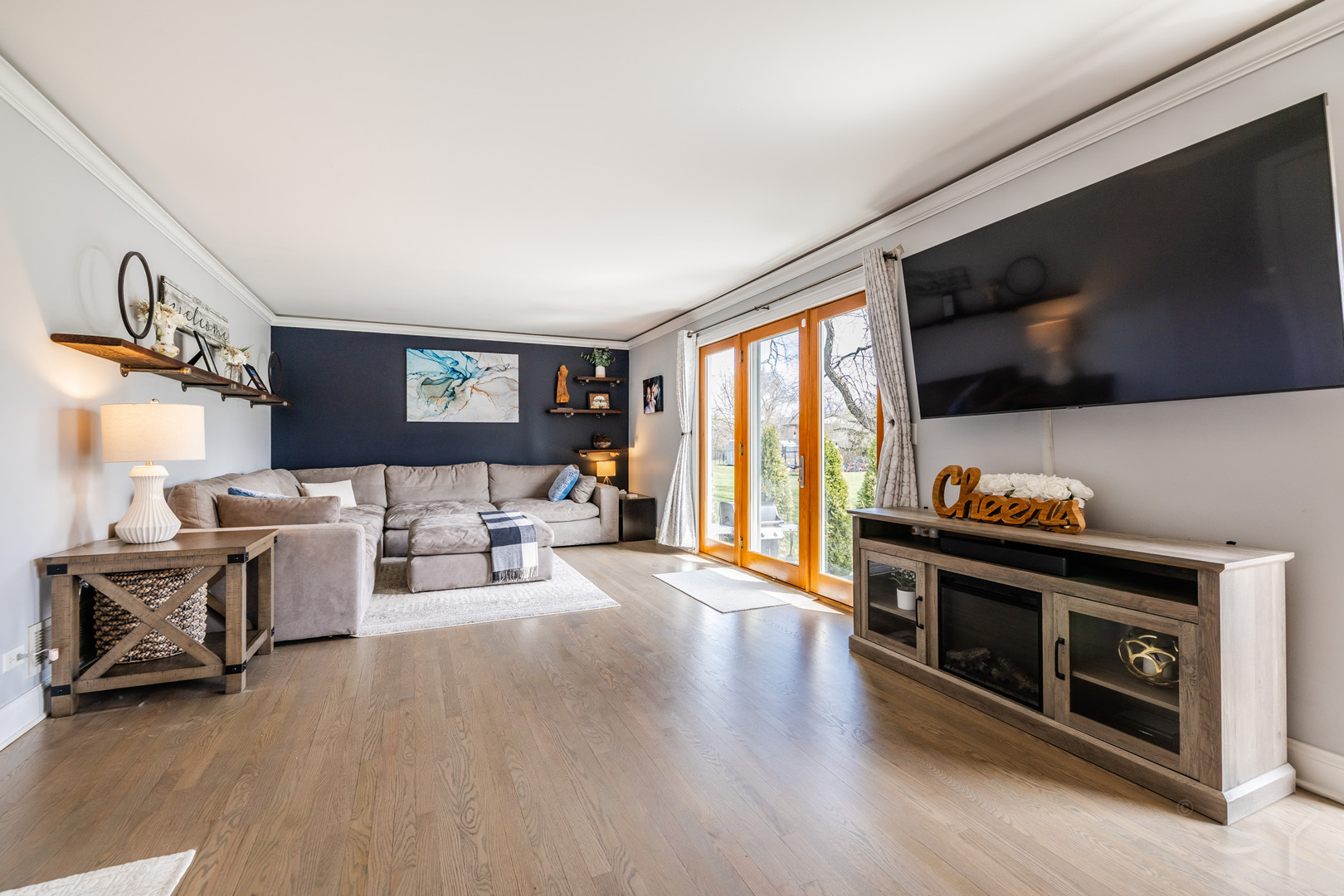 8001 William Drive Willowbrook, IL 60527 - Photo 12 of 73 a living room with furniture and a flat screen tv